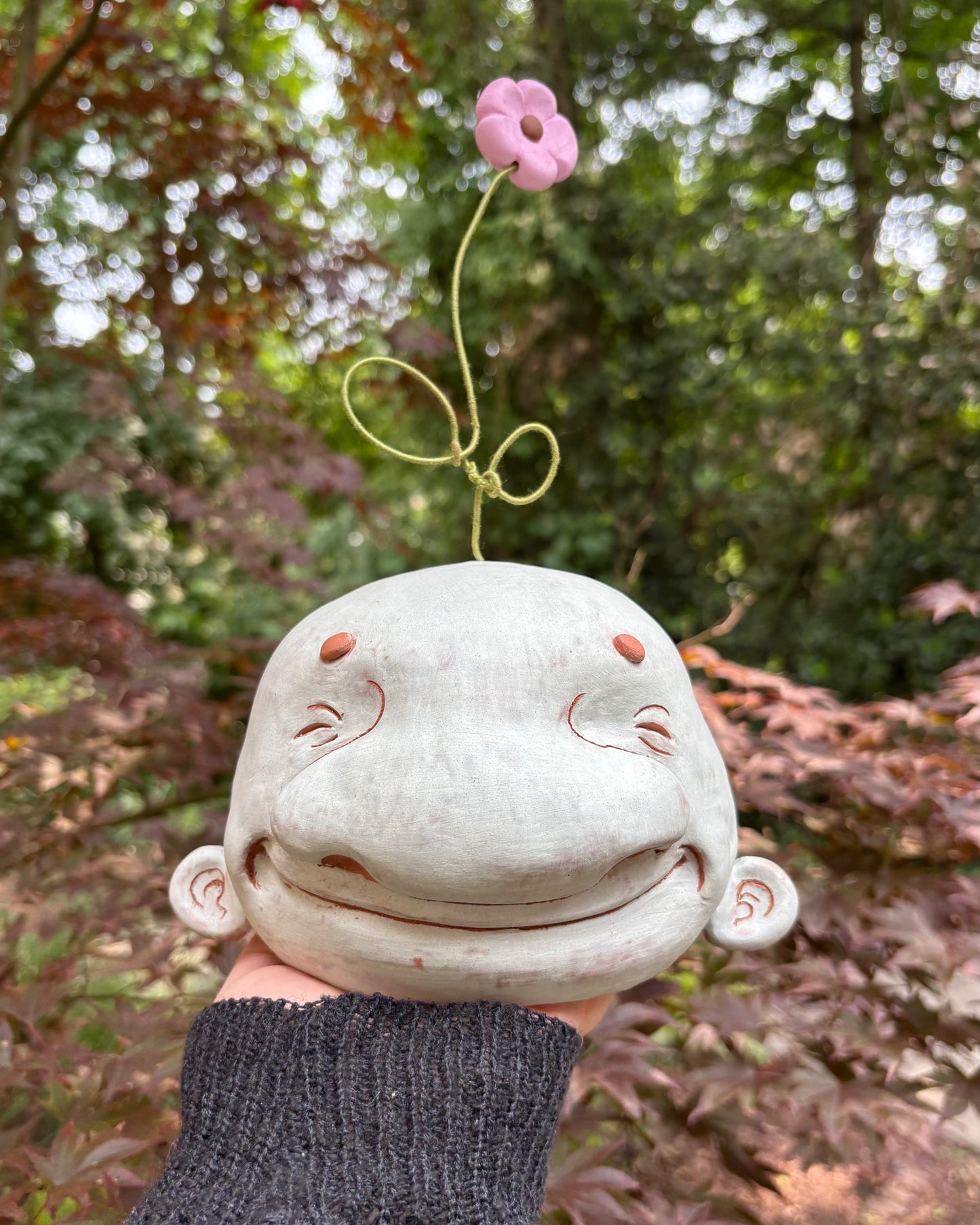 Light Blue Happy Head With A Flower