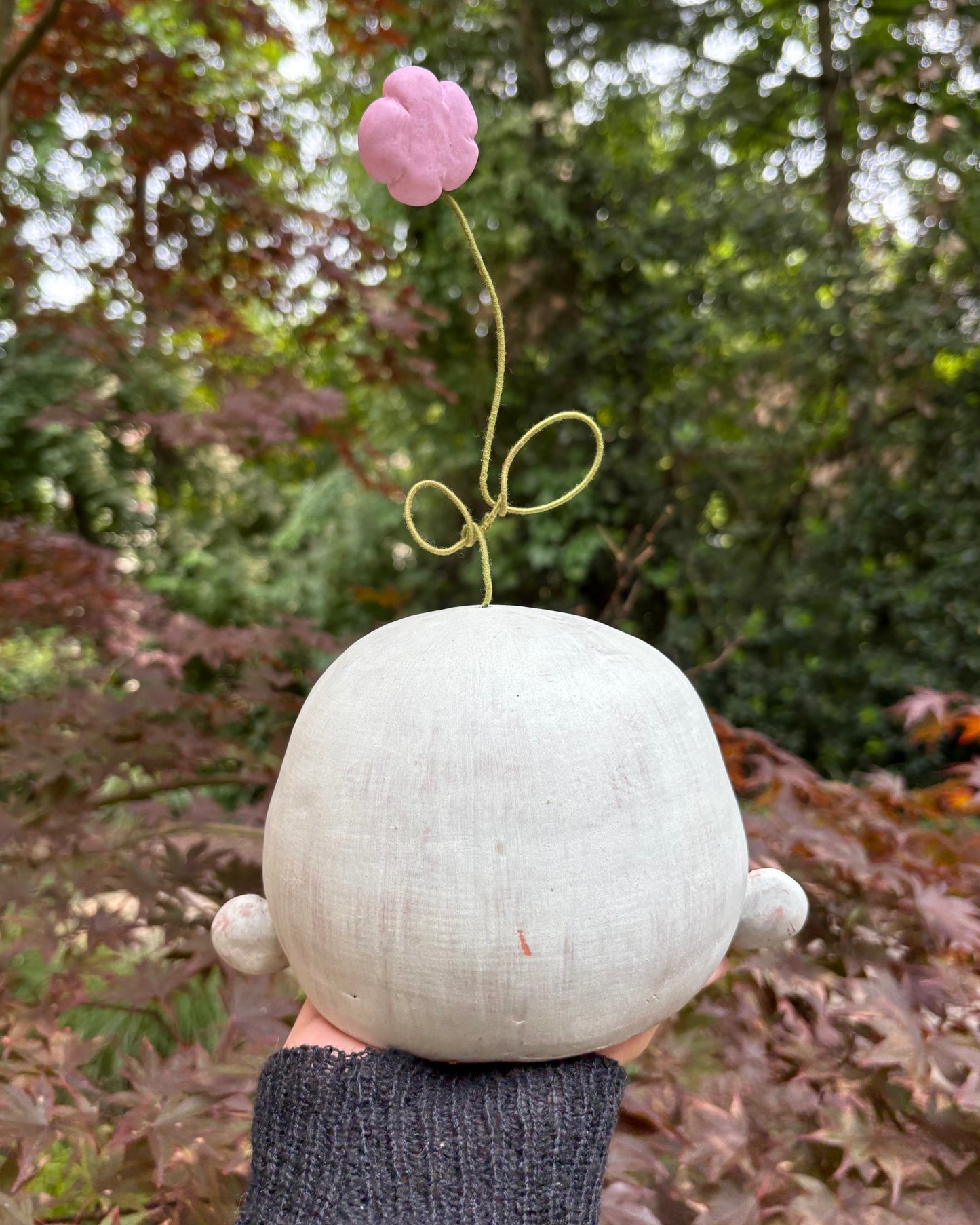 Light Blue Happy Head With A Flower