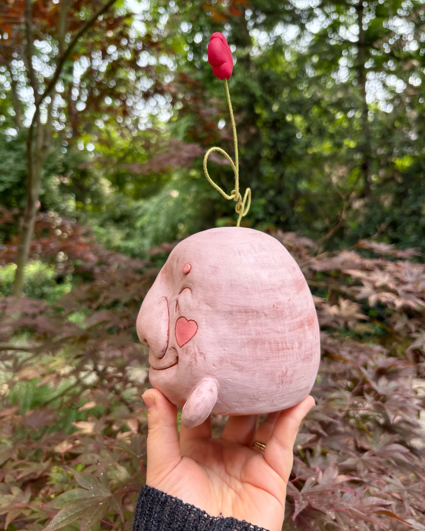 Light Pink Happy Head With A Flower