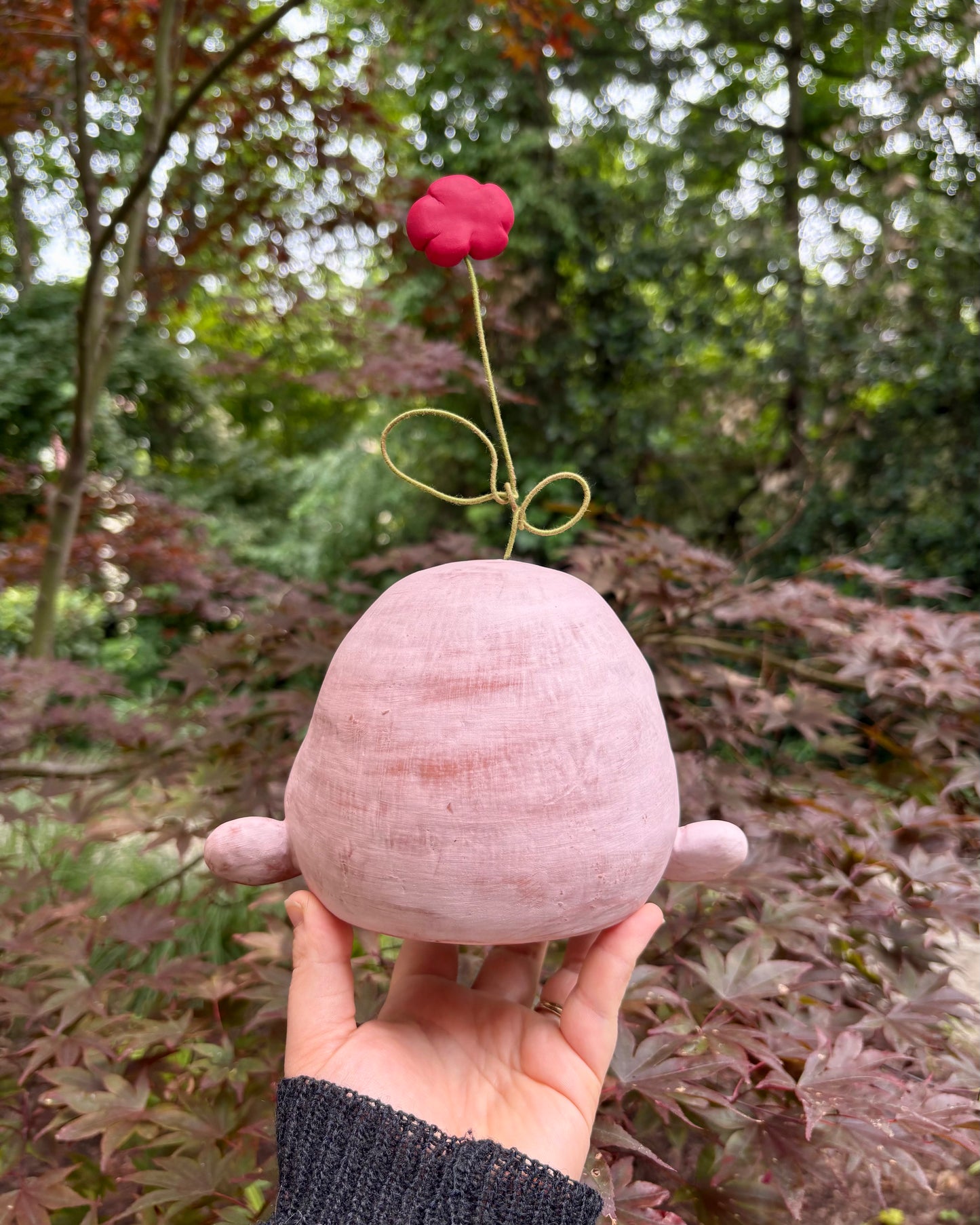 Light Pink Happy Head With A Flower