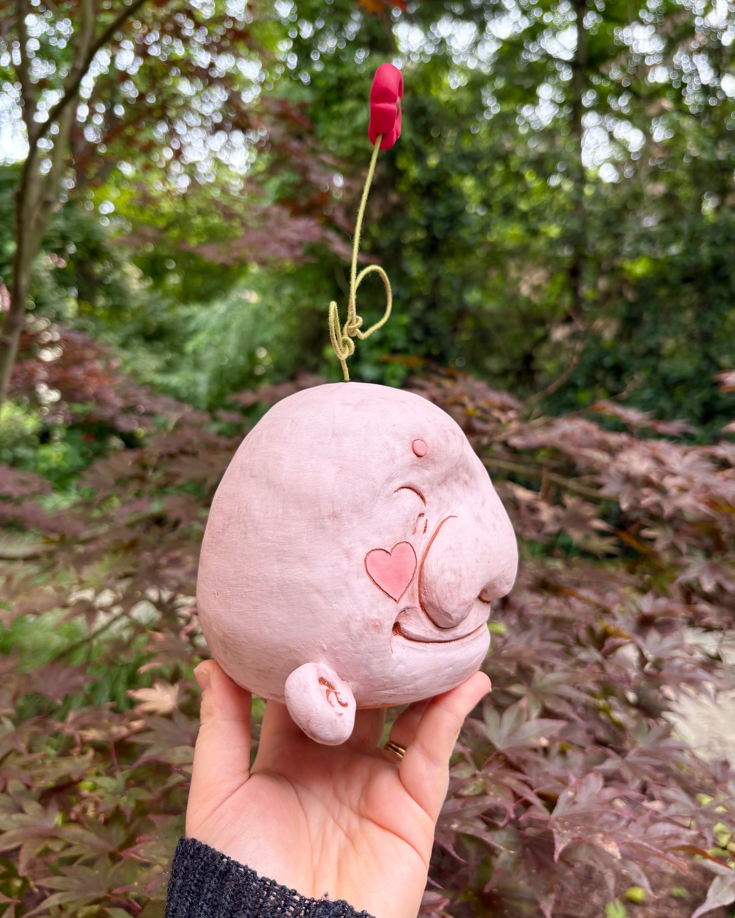 Light Pink Happy Head With A Flower