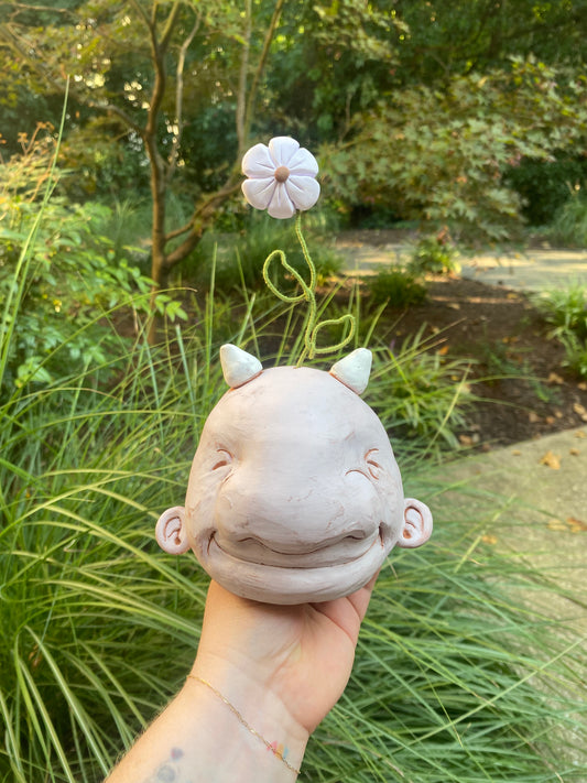 Light Pink Happy Head With A Flower