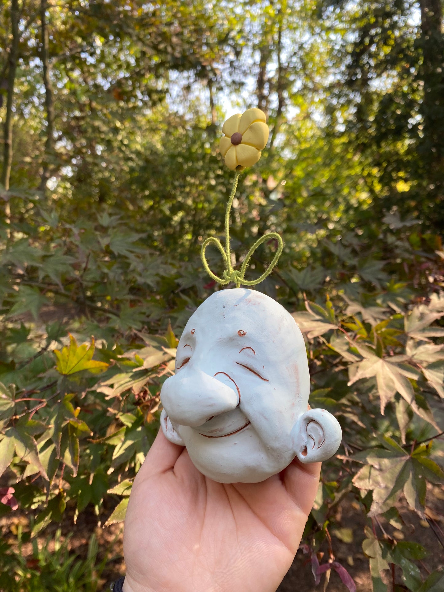 Light Blue Wall-Hanging Mask with a Flower