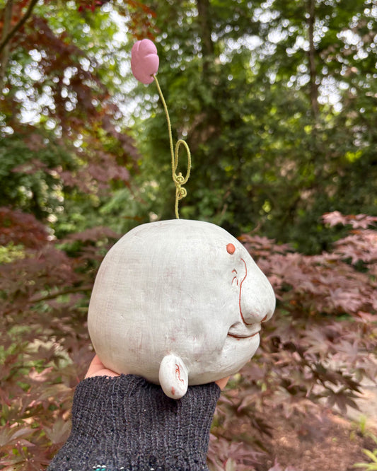 Light Blue Happy Head With A Flower