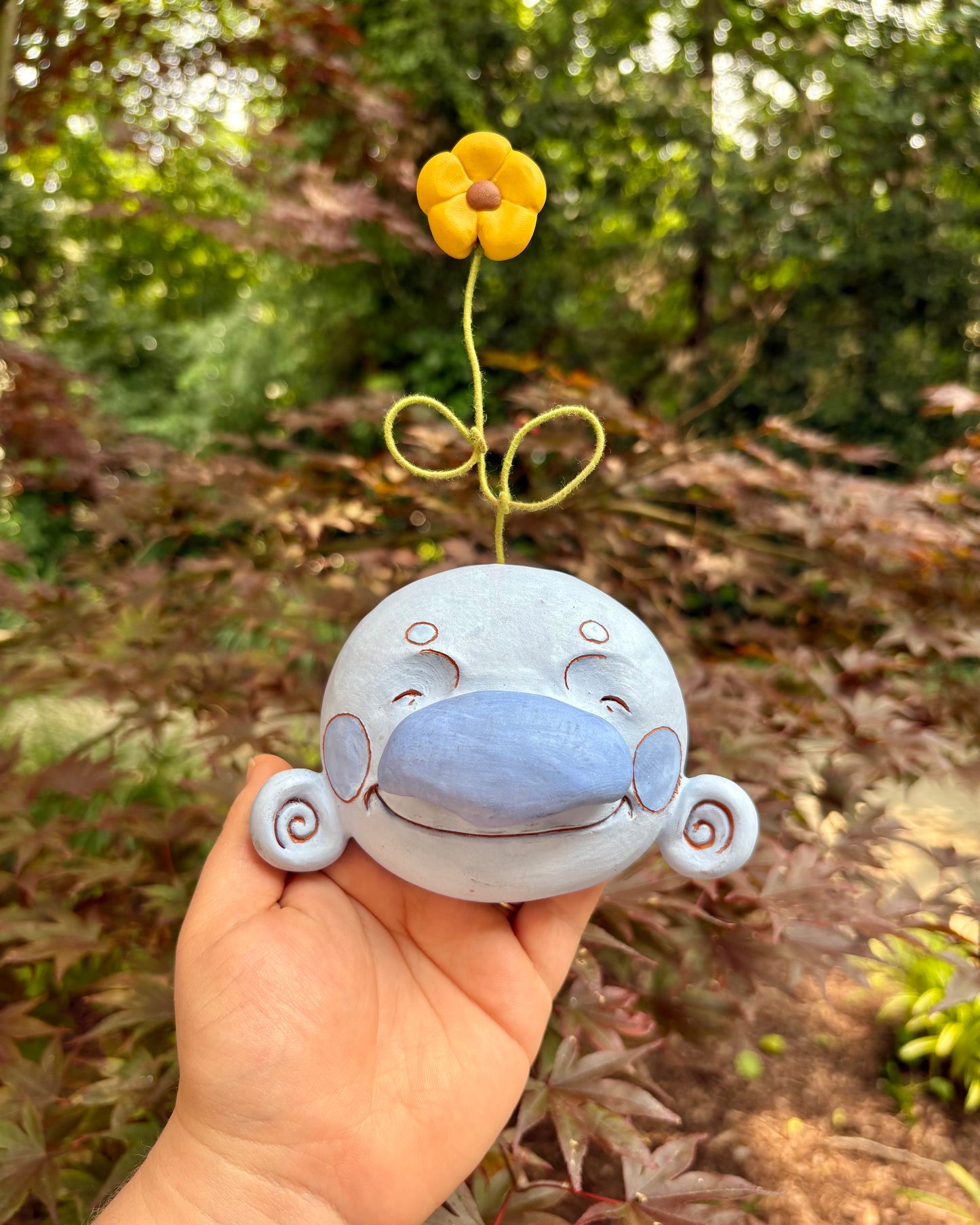 Blue Wall-Hanging Mask with a Flower