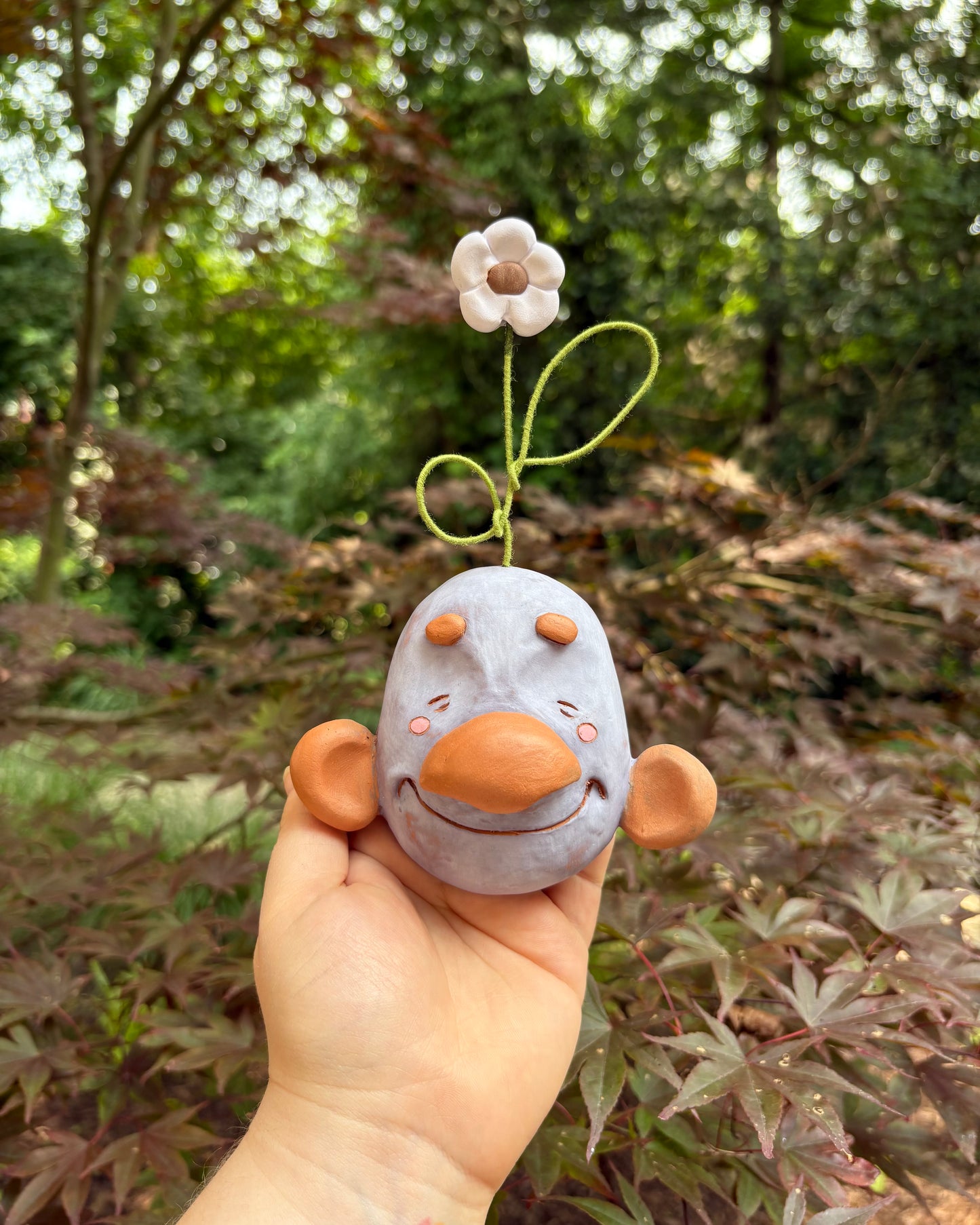 Purple Wall-Hanging Mask with a Flower